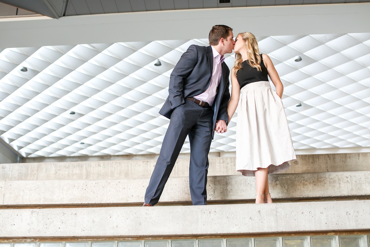 bride and groom kissing during engagement photoshoot